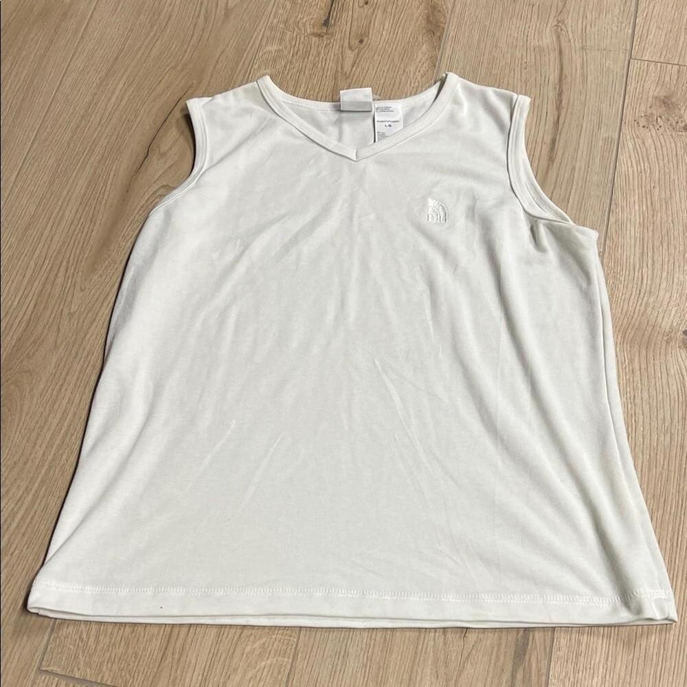 The North Face off white-cream Sleeveless Top
Off white sleeveless top with su